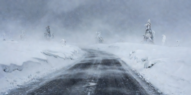 Deep snow and icy road in Norwegian winter conditions